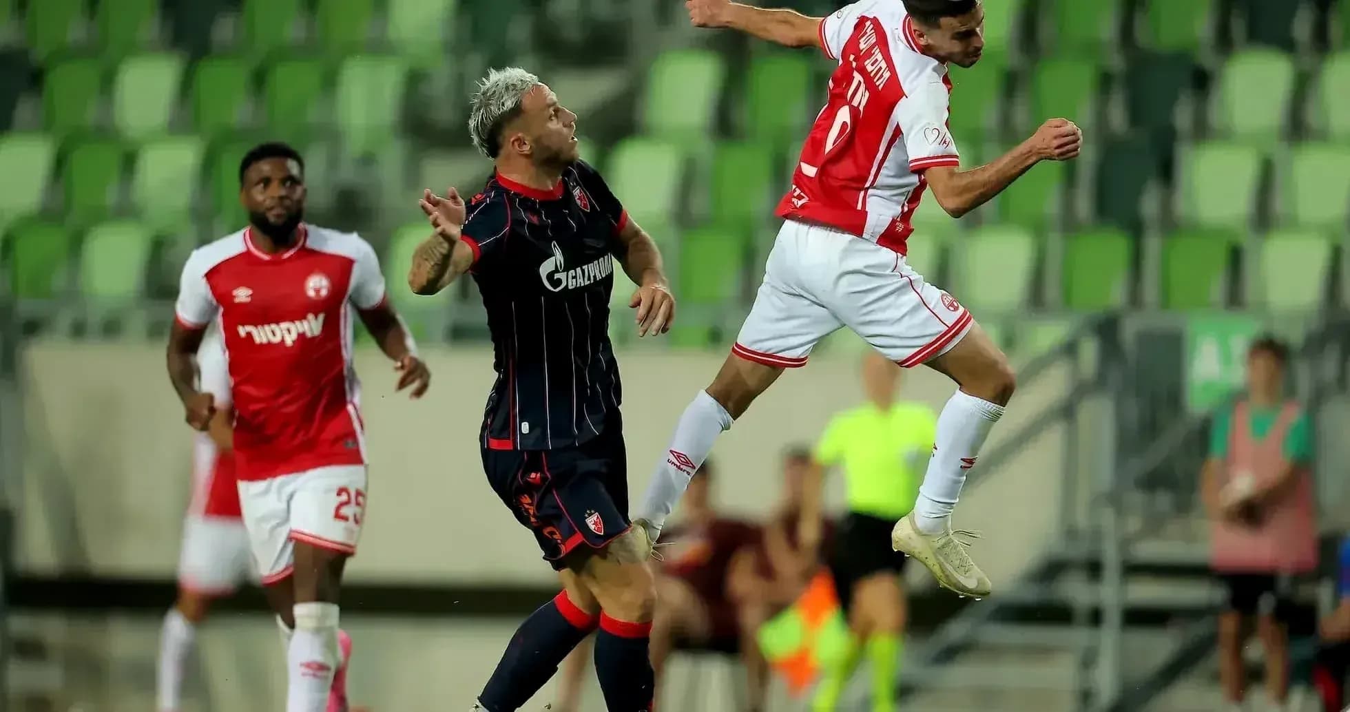 Crvena Zvezda player challenging for the ball Crvena Zvezda player challenging for the ball