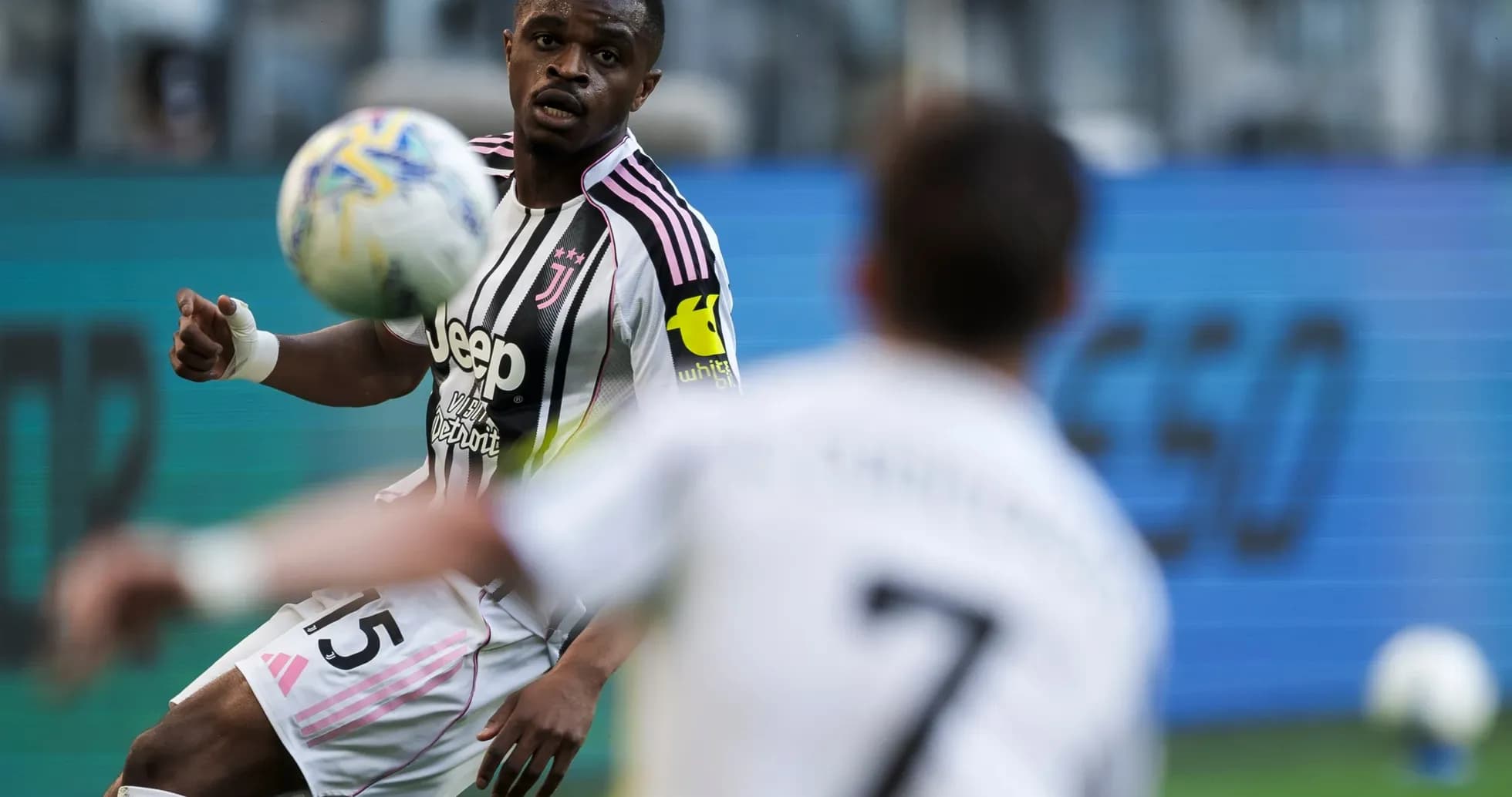Juventus player controlling the ball during match Juventus player controlling the ball during match