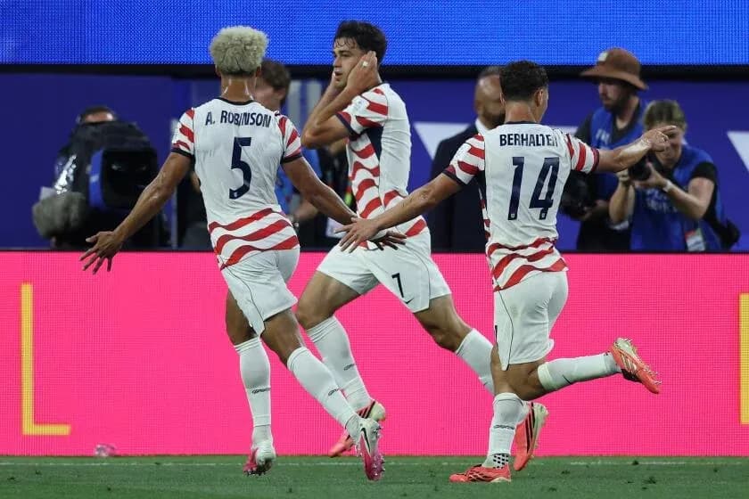 Three USA players celebrating a goal during match Three USA players celebrating a goal during match