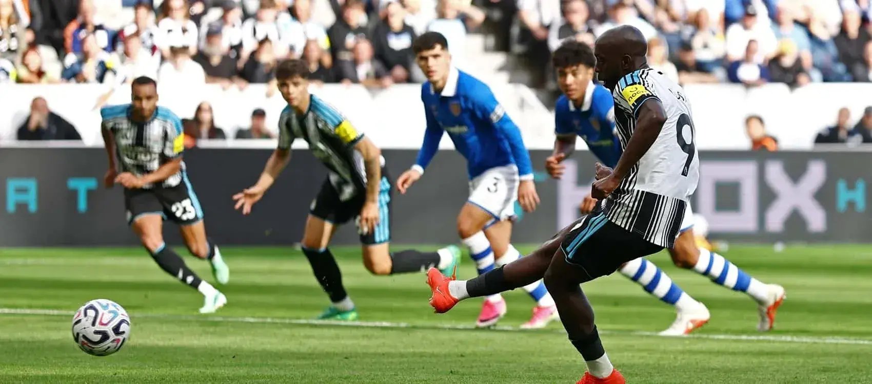 Player taking a penalty kick during a match Player taking a penalty kick during a match