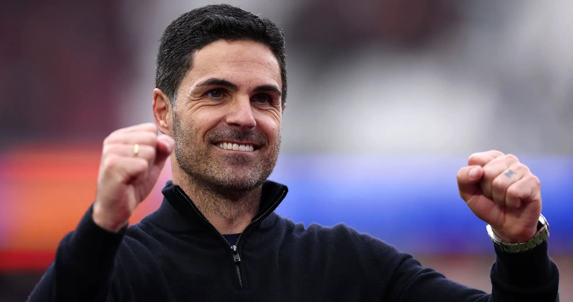Coach celebrating with clenched fist during match Coach celebrating with clenched fist during match