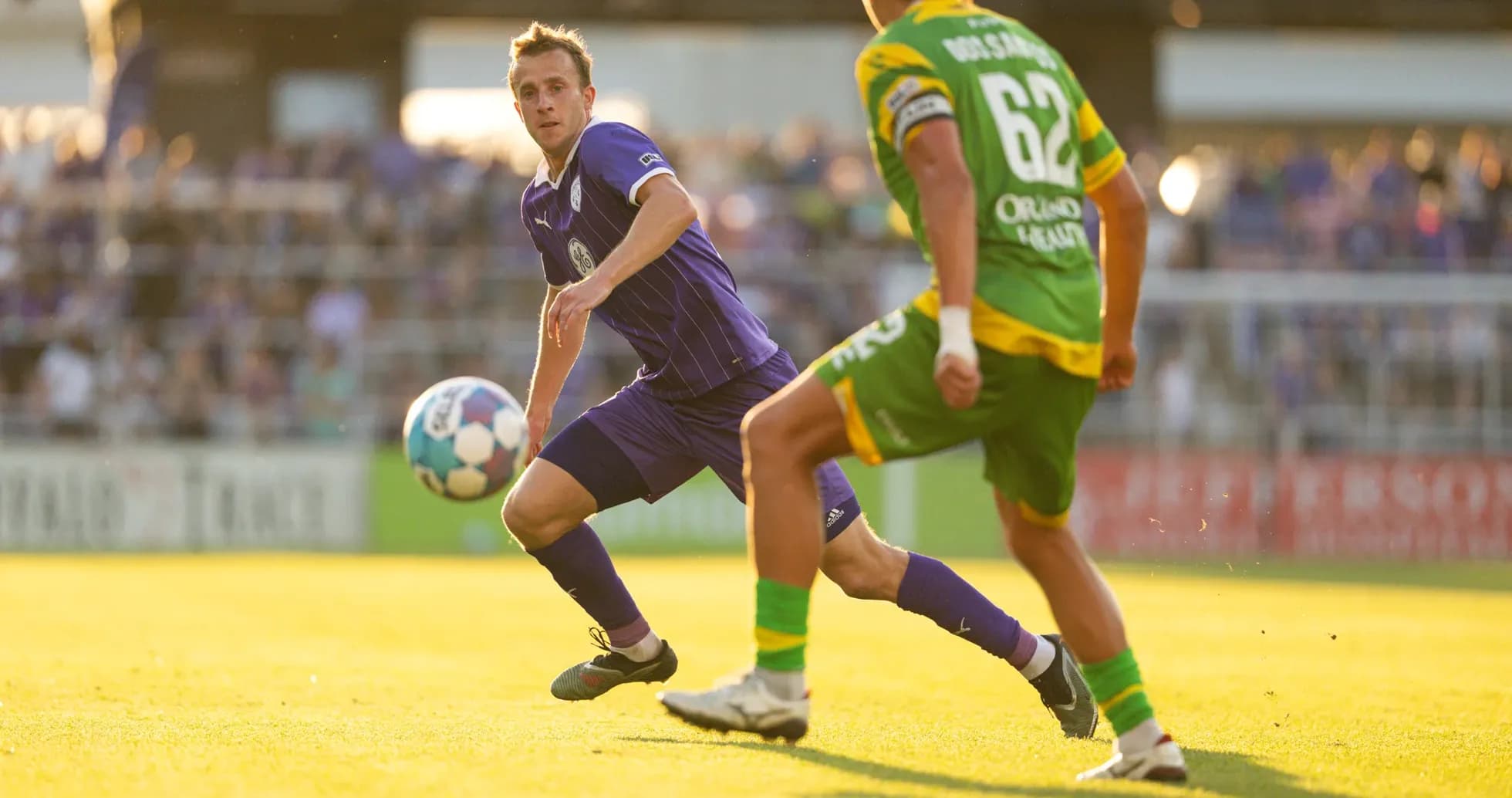 Louisville City player passing the ball during match Louisville City player passing the ball during match