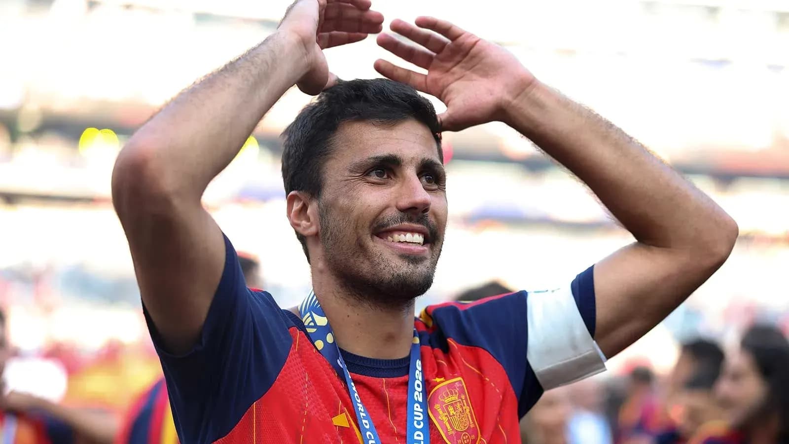 Player celebrating with arms raised after match Player celebrating with arms raised after match