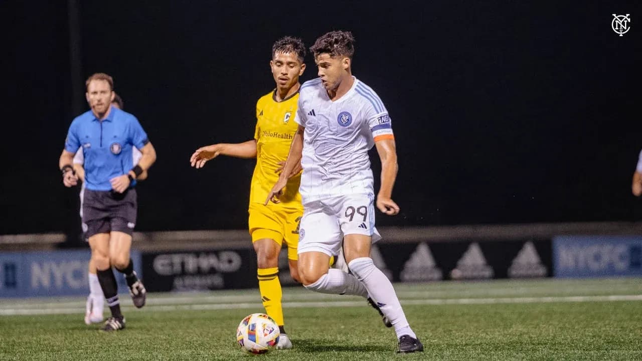 New York City II player dribbling past Columbus Crew II opponent New York City II player dribbling past Columbus Crew II opponent