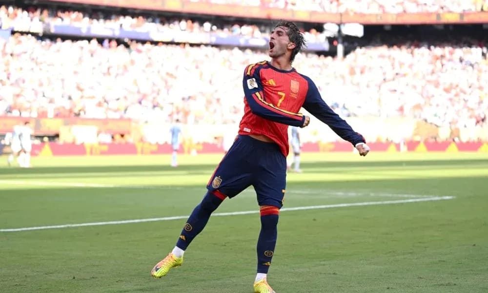 Player celebrating a goal during a football match Player celebrating a goal during a football match