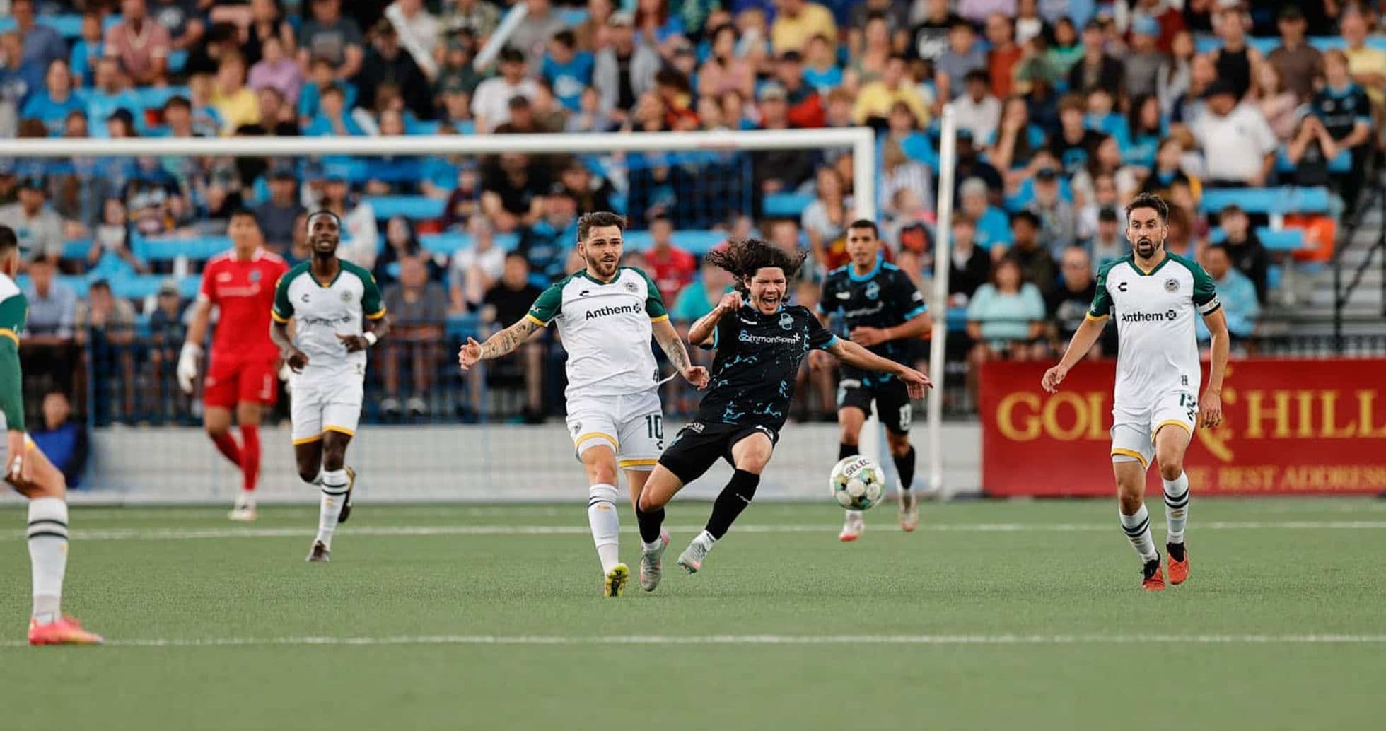 Players competing for the ball in USL match Players competing for the ball in USL match
