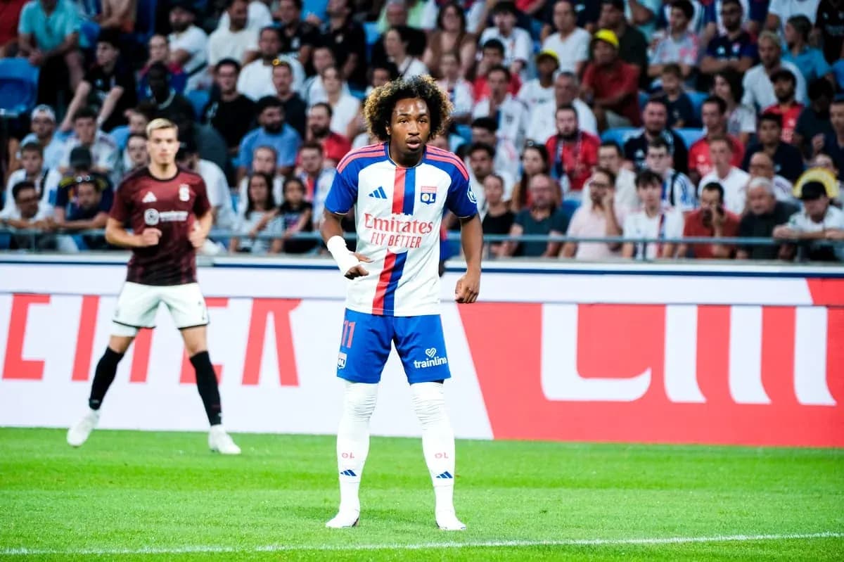 Player in Olympique Lyonnais kit on the field Player in Olympique Lyonnais kit on the field