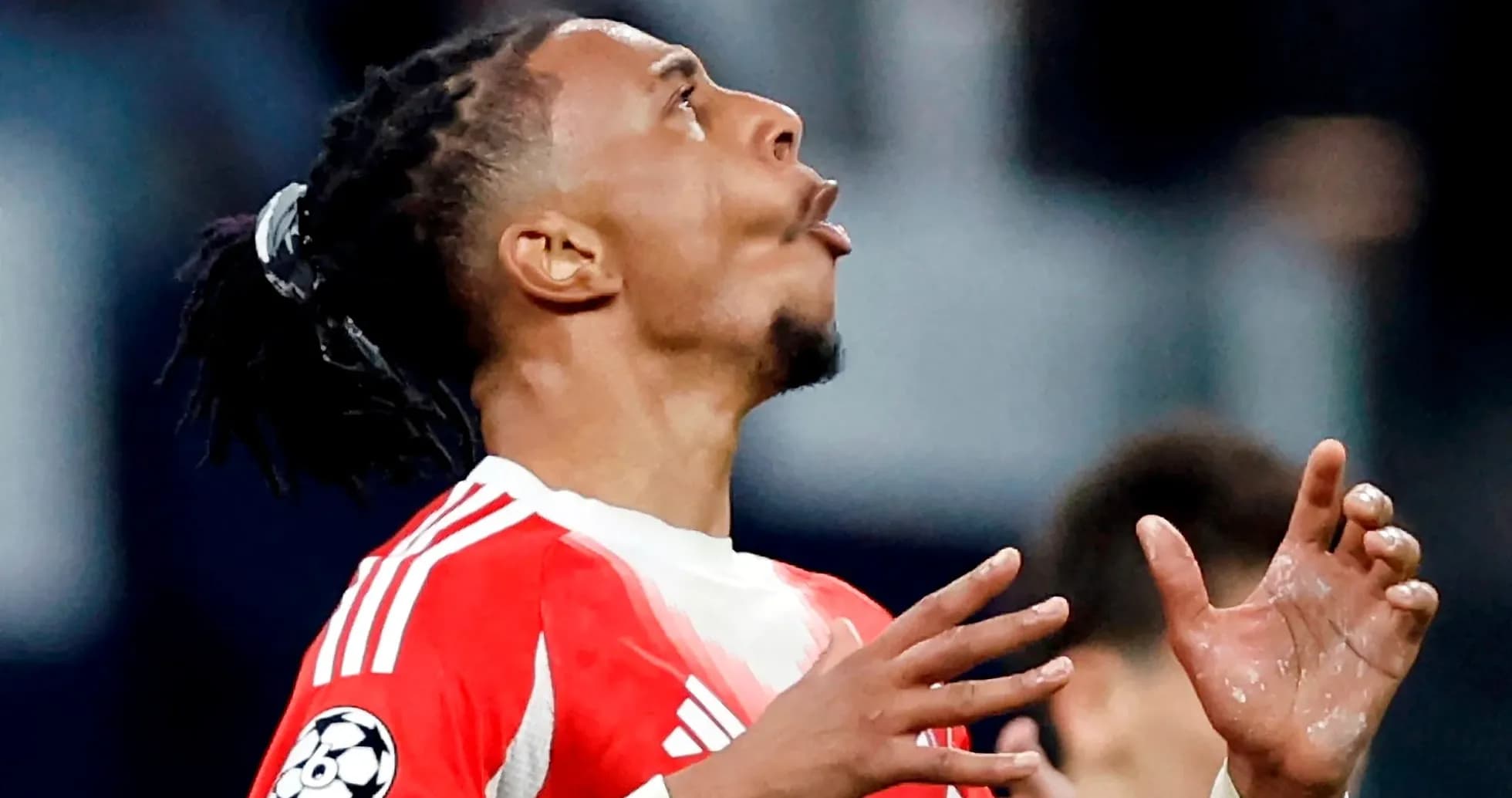 Player looking upwards during a match celebration Player looking upwards during a match celebration