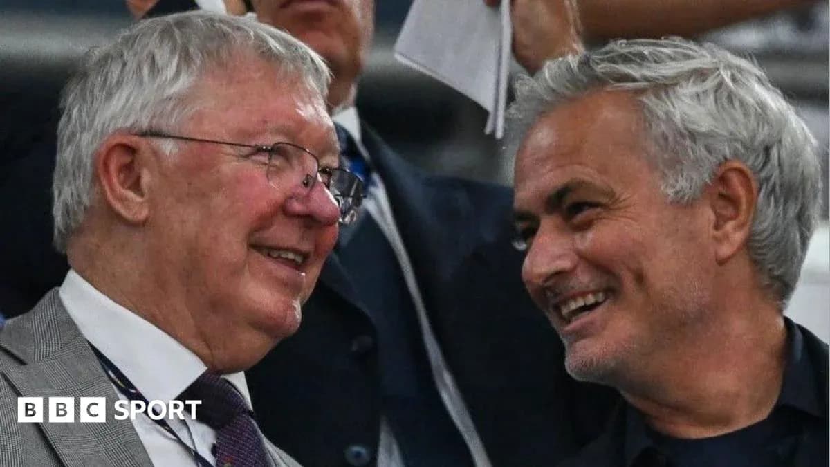 Two men smiling and chatting in the stands Two men smiling and chatting in the stands