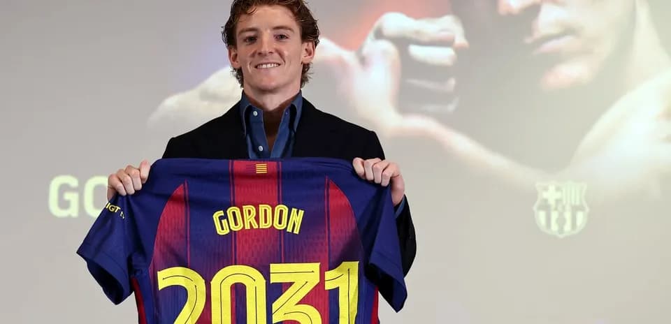 Player holding Barcelona jersey with name and number Player holding Barcelona jersey with name and number
