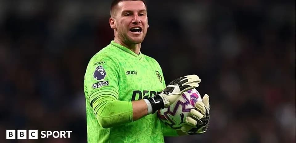 Goalkeeper in green kit holding a football Goalkeeper in green kit holding a football