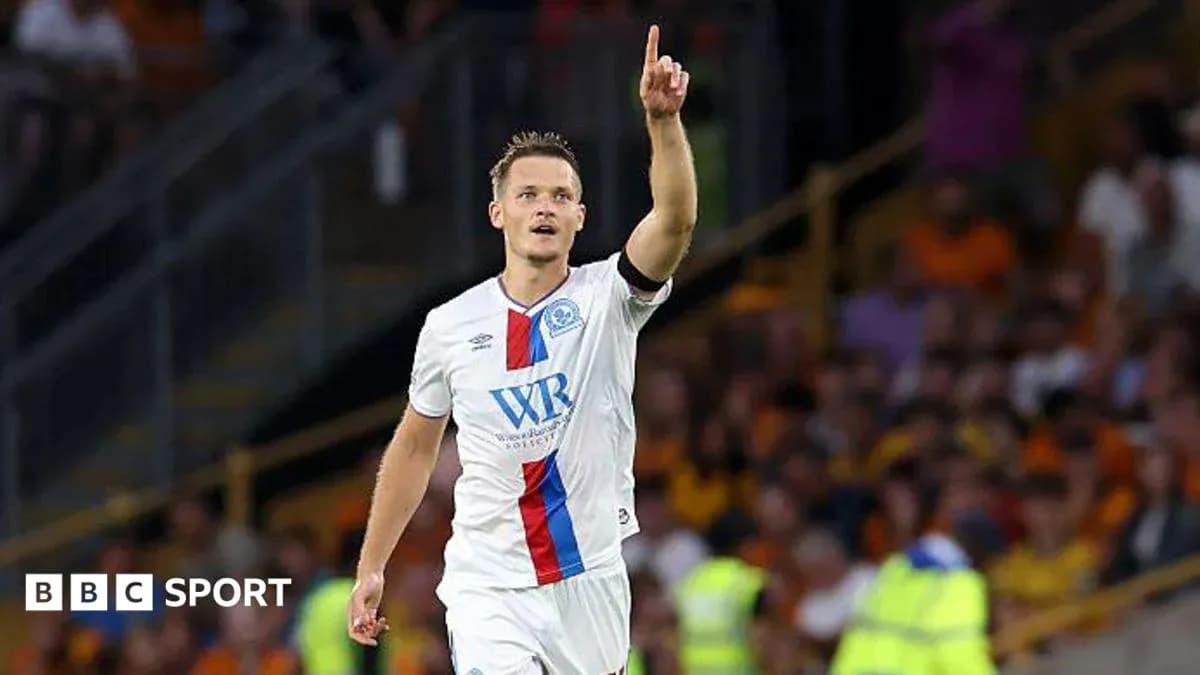 Player celebrating a goal with raised finger Player celebrating a goal with raised finger