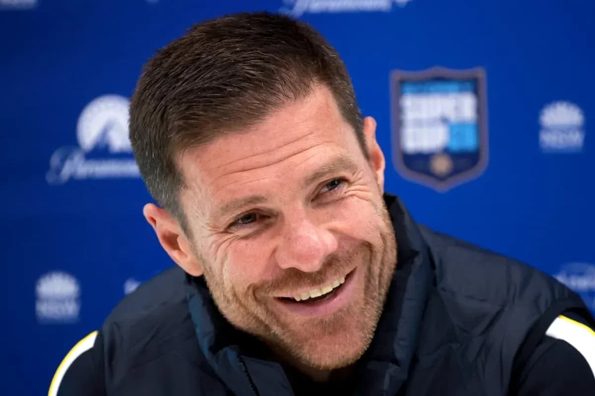 Coach smiling during press conference at podium Coach smiling during press conference at podium