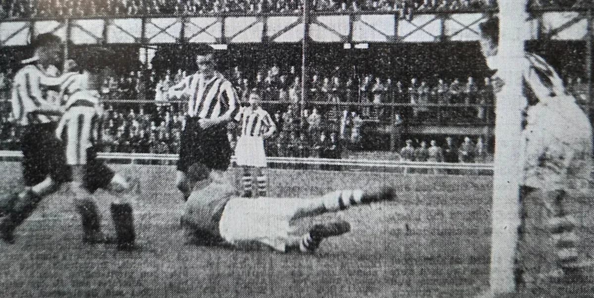 Player falling down during historical football match Player falling down during historical football match