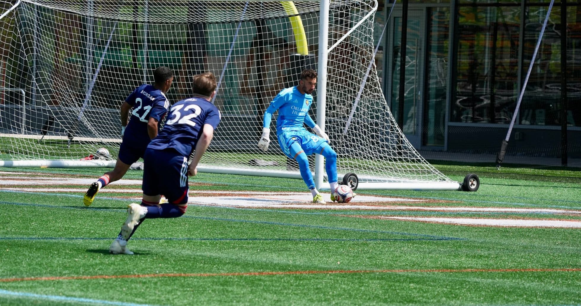 Goalkeeper preparing to save shot during match Goalkeeper preparing to save shot during match