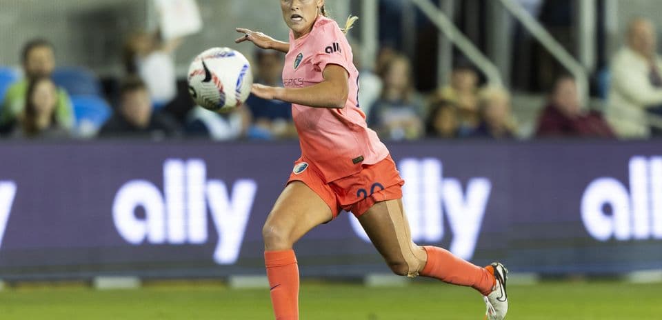 Player dribbling ball during NWSL match Player dribbling ball during NWSL match