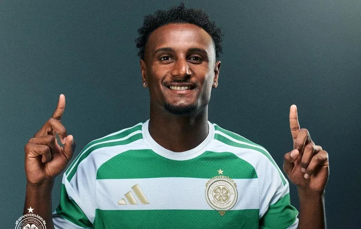 Player posing in Celtic FC jersey with finger raised Player posing in Celtic FC jersey with finger raised