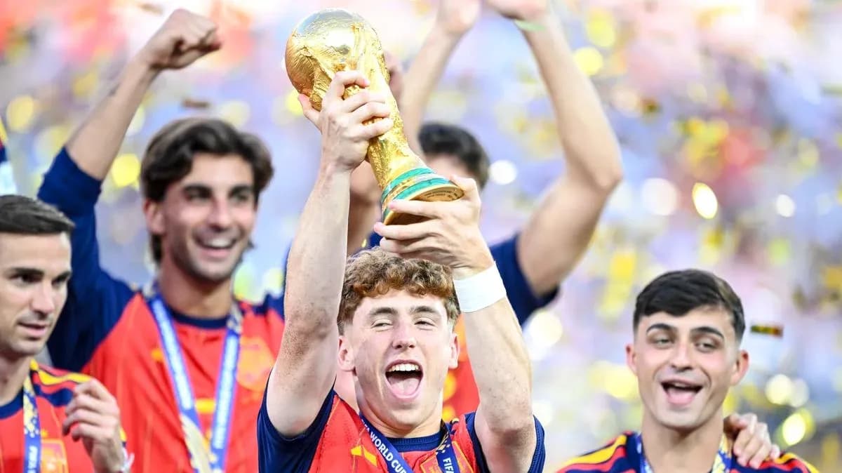 Player celebrating with FIFA World Cup trophy and teammates Player celebrating with FIFA World Cup trophy and teammates