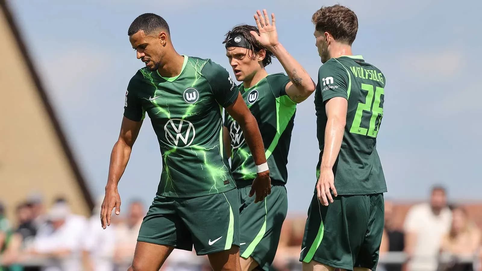 Wolfsburg players celebrating during a match Wolfsburg players celebrating during a match