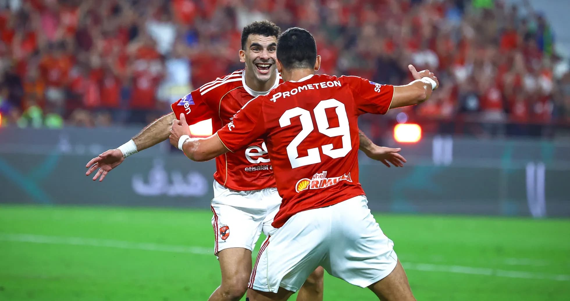 Players celebrating a goal during a match Players celebrating a goal during a match