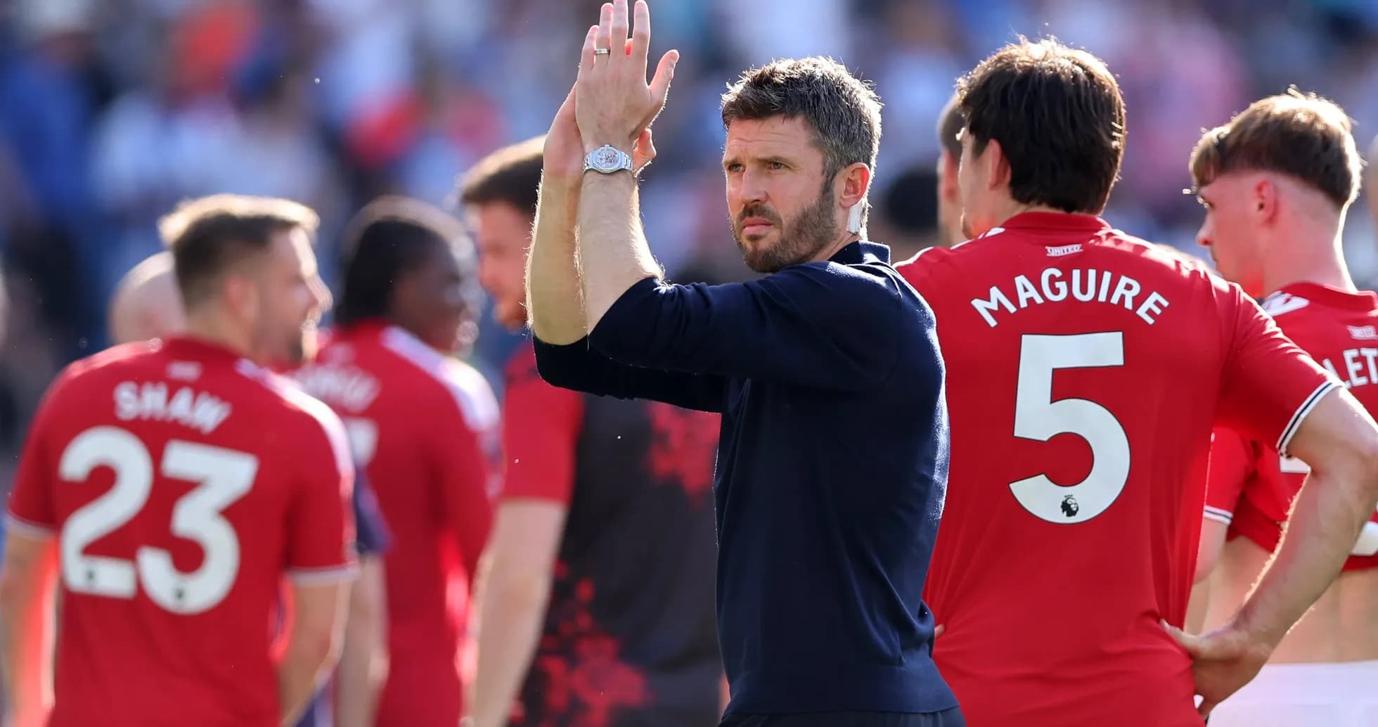 Manager applauding players after match with team Manager applauding players after match with team
