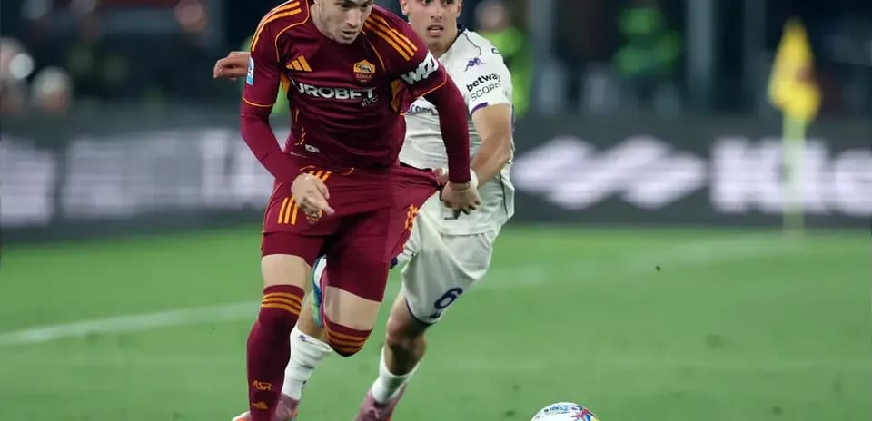 Player from AS Roma dribbling past opponent during match Player from AS Roma dribbling past opponent during match