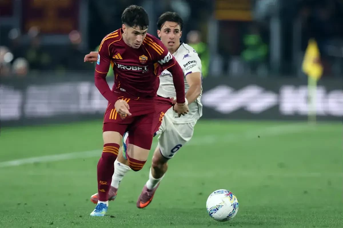 Player from AS Roma dribbling past opponent during match Player from AS Roma dribbling past opponent during match
