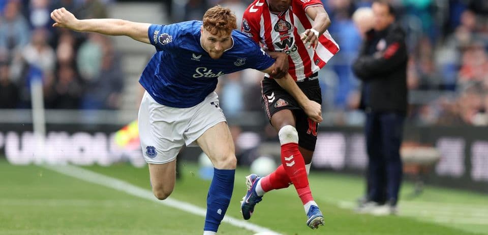 Everton player challenging Sunderland opponent for the ball Everton player challenging Sunderland opponent for the ball