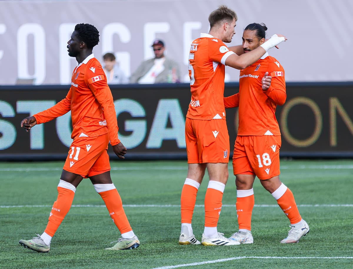 Players celebrating during Forge FC match Players celebrating during Forge FC match