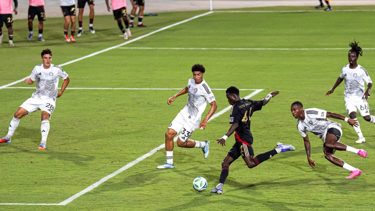 Huntsville City player dribbling past defenders Huntsville City player dribbling past defenders