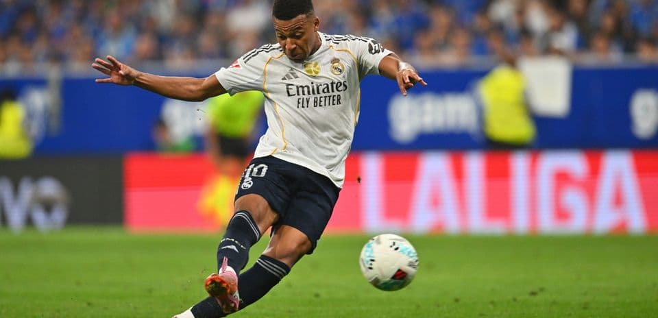 Player kicking ball during Real Madrid match Player kicking ball during Real Madrid match