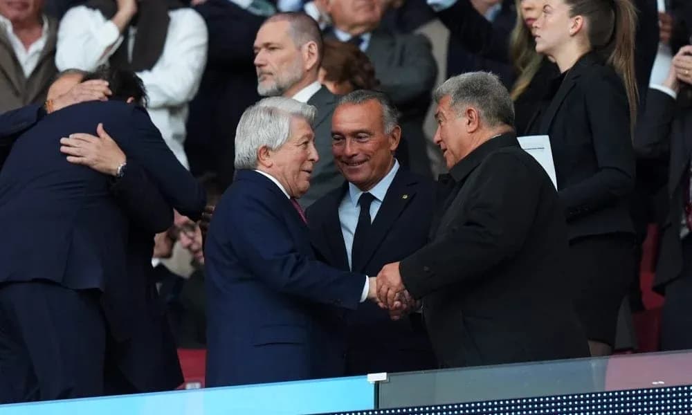 Executives greeting each other in stadium stands Executives greeting each other in stadium stands