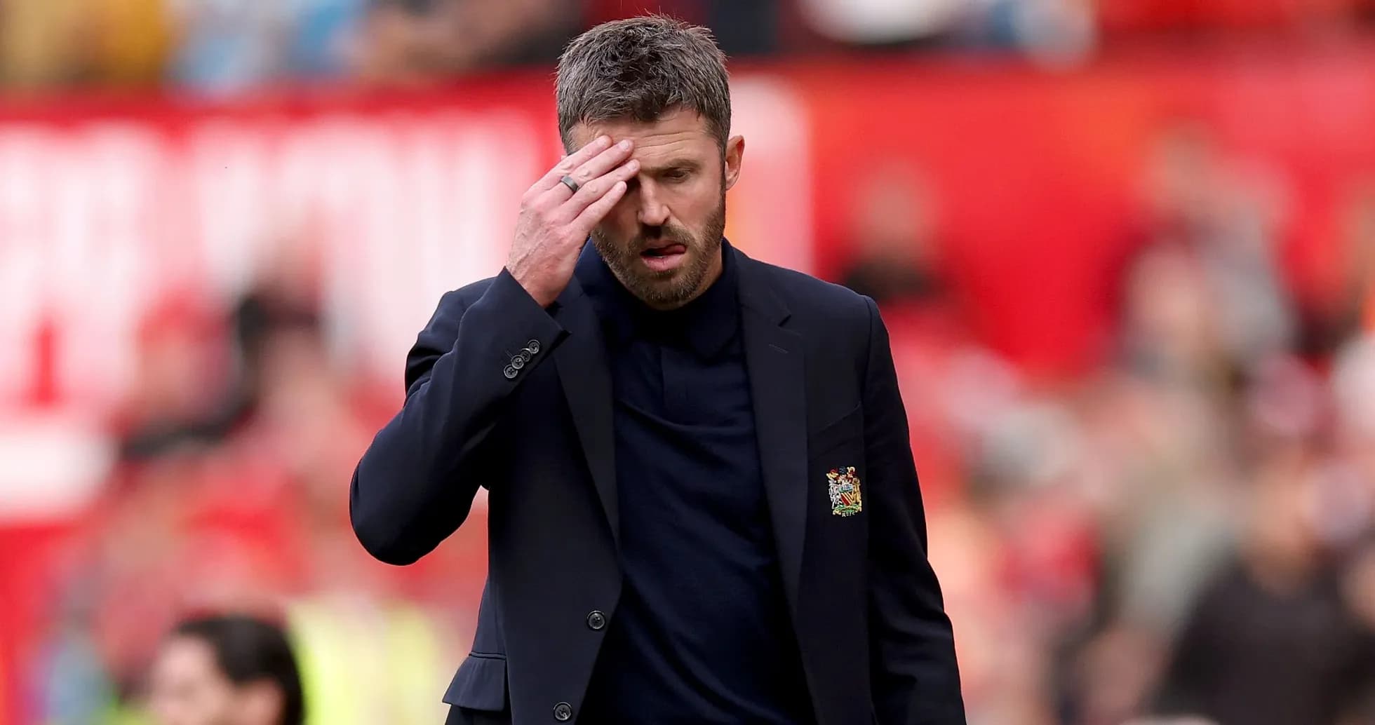 Manager walking on pitch with hand on forehead Manager walking on pitch with hand on forehead