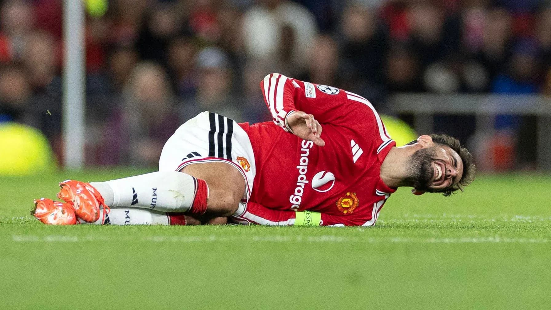 Player lying on the ground in pain during match Player lying on the ground in pain during match