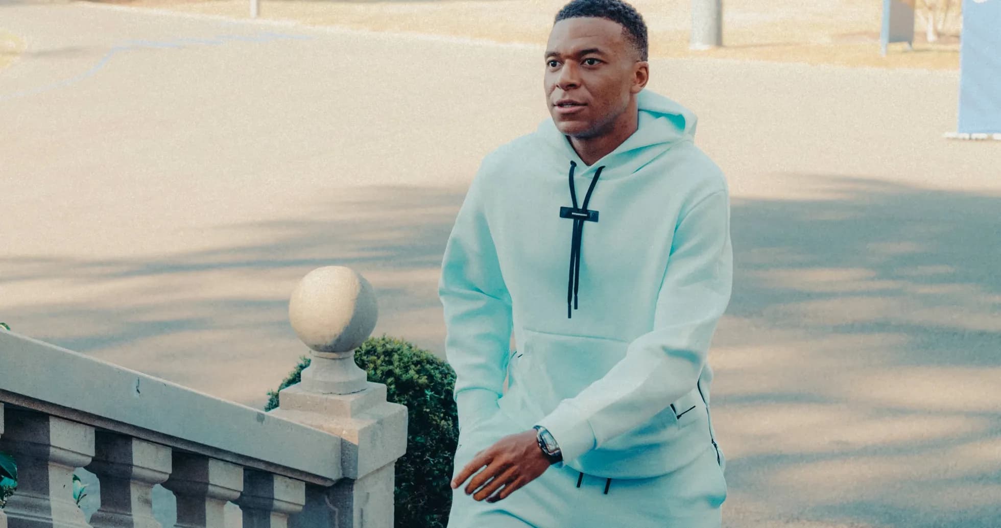 Player walking up steps in light blue tracksuit Player walking up steps in light blue tracksuit