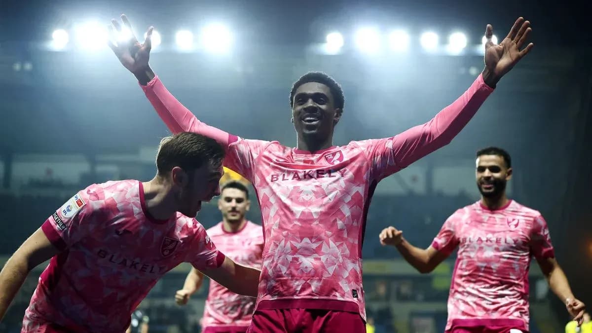 Players celebrating a goal during a match Players celebrating a goal during a match
