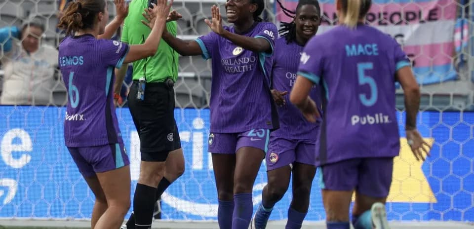 Orlando Pride players celebrating a goal Orlando Pride players celebrating a goal