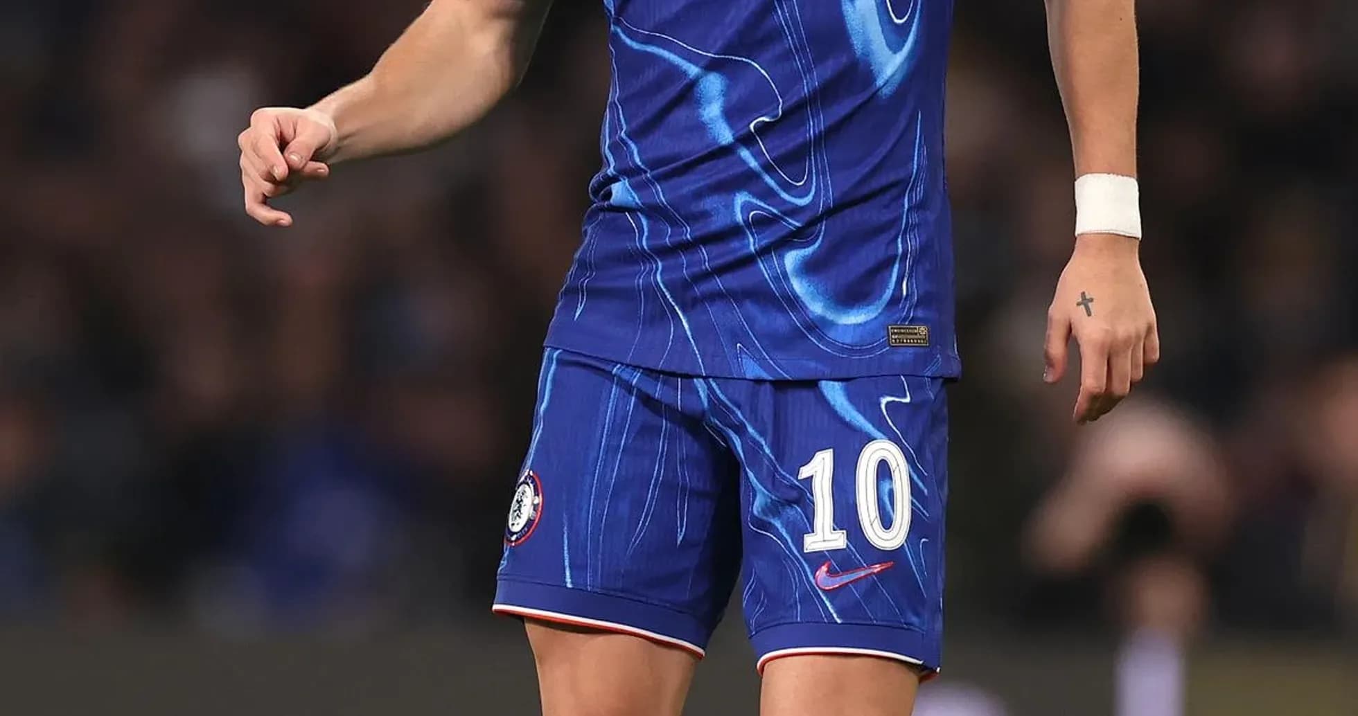 Player in Chelsea kit preparing to kick ball Player in Chelsea kit preparing to kick ball