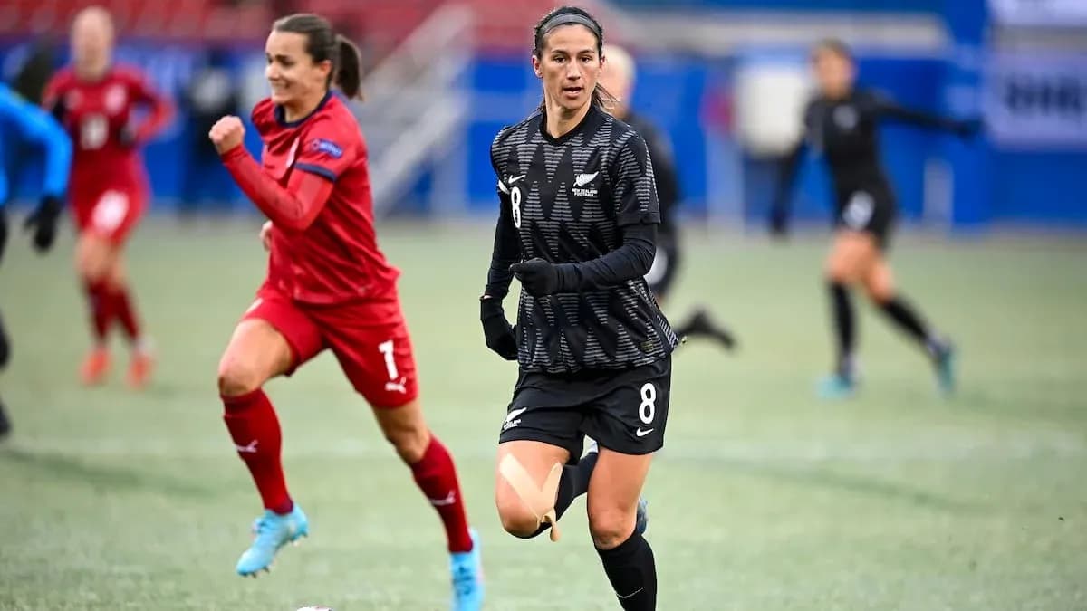 Player in black jersey running during match Player in black jersey running during match