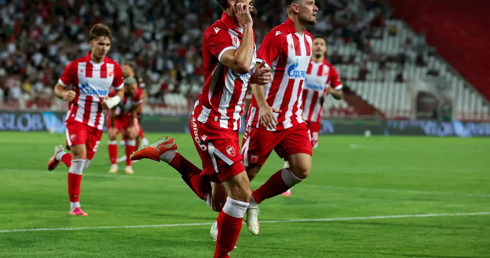 Player celebrating goal during Crvena Zvezda match Player celebrating goal during Crvena Zvezda match