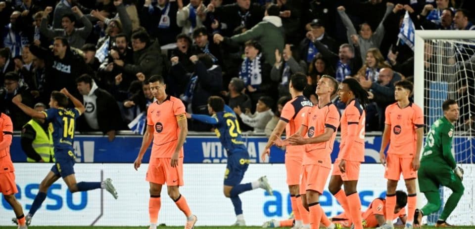 Players in orange jerseys reacting during match celebration Players in orange jerseys reacting during match celebration