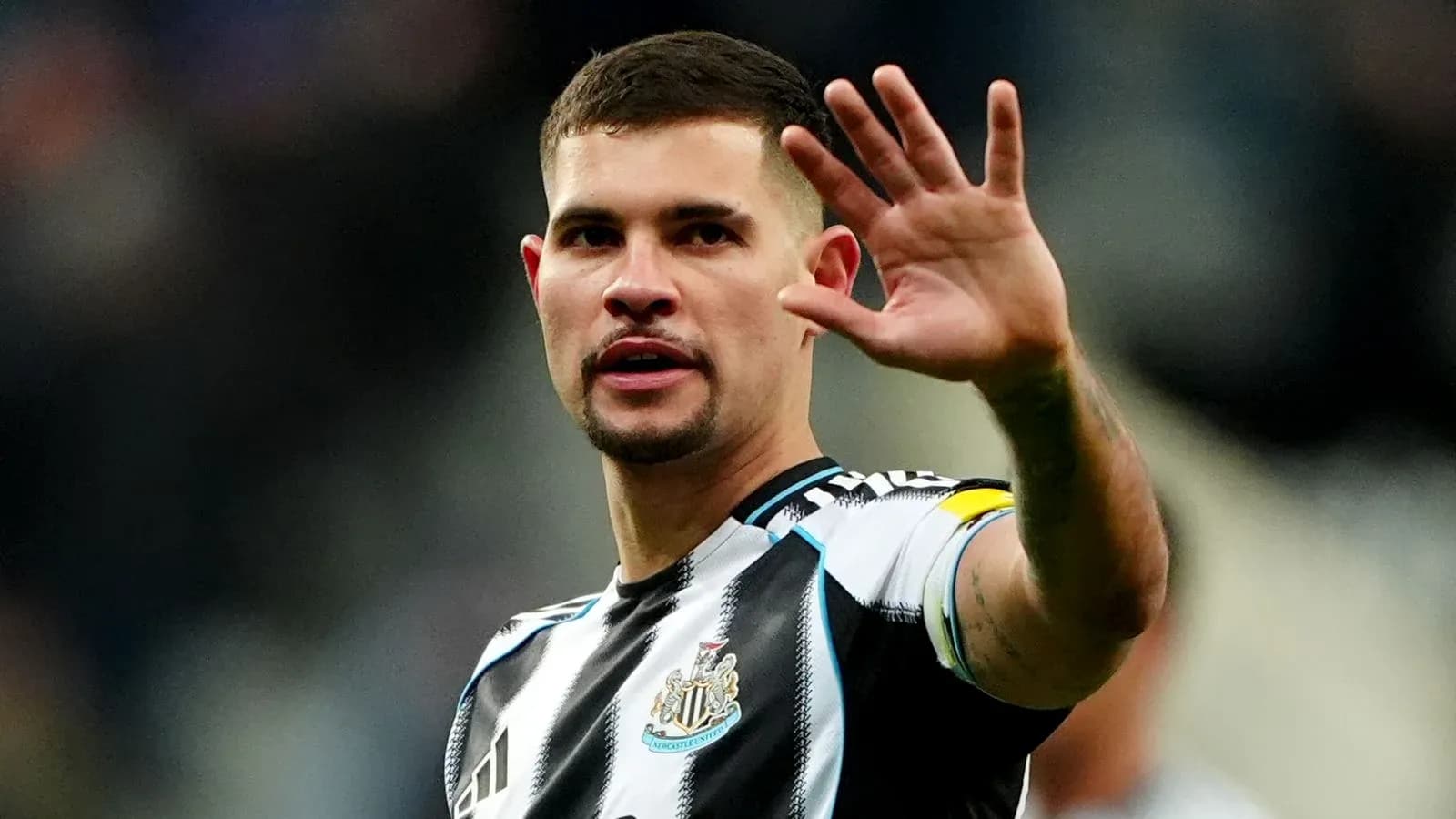 Player gesturing during match at stadium Player gesturing during match at stadium