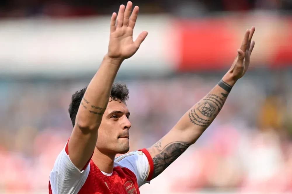 Player waving to fans during match celebration Player waving to fans during match celebration