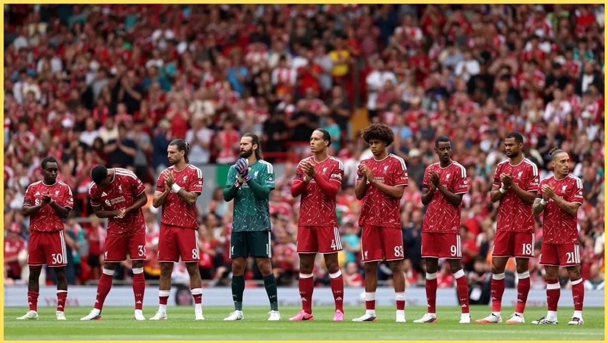 Liverpool players lined up, applauding fans at Anfield Liverpool players lined up, applauding fans at Anfield