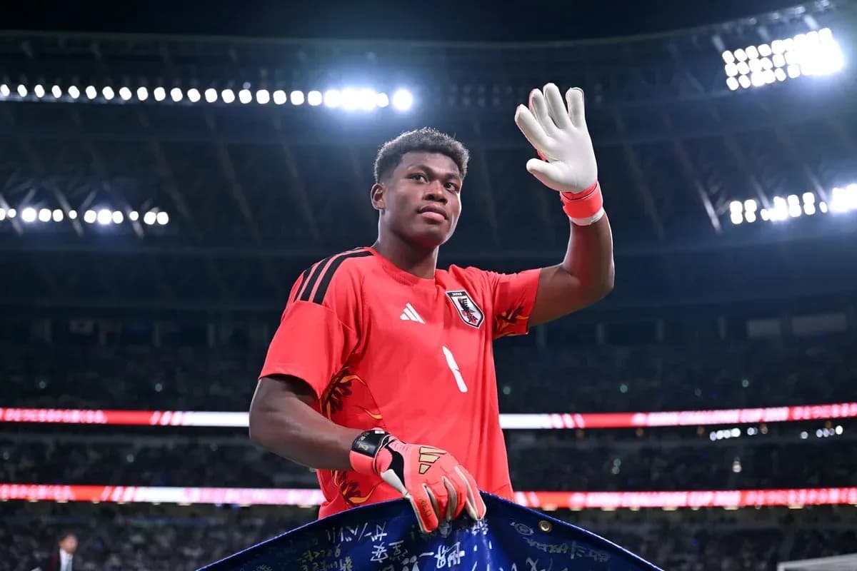 Goalkeeper waving while holding a team flag Goalkeeper waving while holding a team flag
