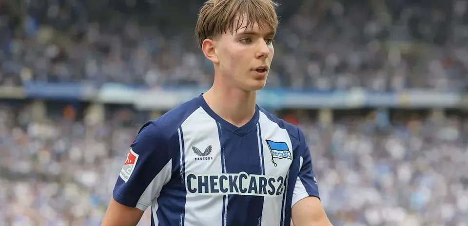 Player in Hertha BSC jersey on the field Player in Hertha BSC jersey on the field