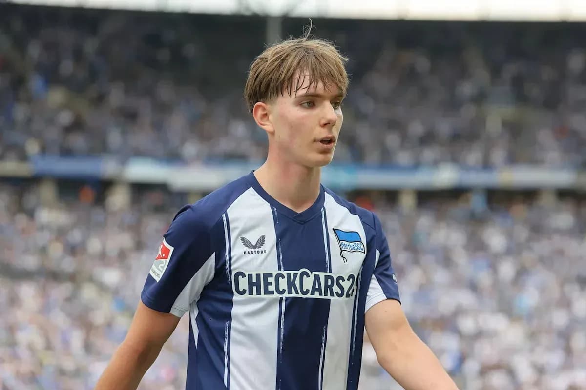 Player in Hertha BSC jersey on the field Player in Hertha BSC jersey on the field