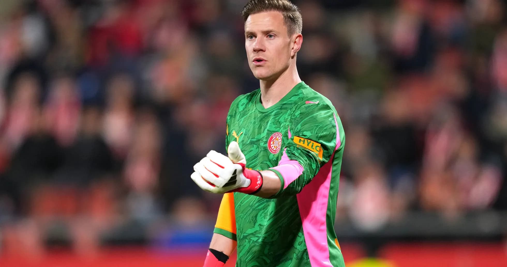 Goalkeeper gesturing during a football match Goalkeeper gesturing during a football match