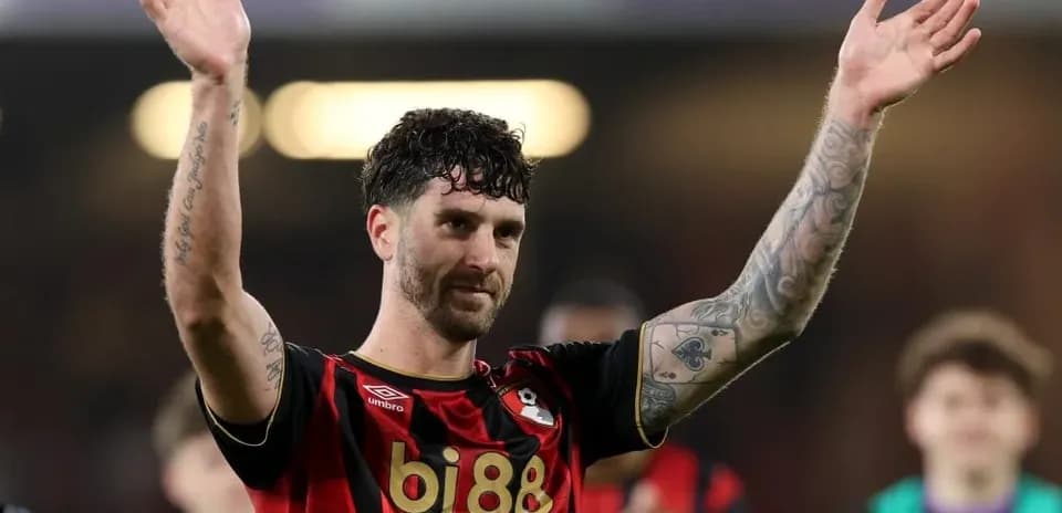 Player celebrating with fans after match victory Player celebrating with fans after match victory