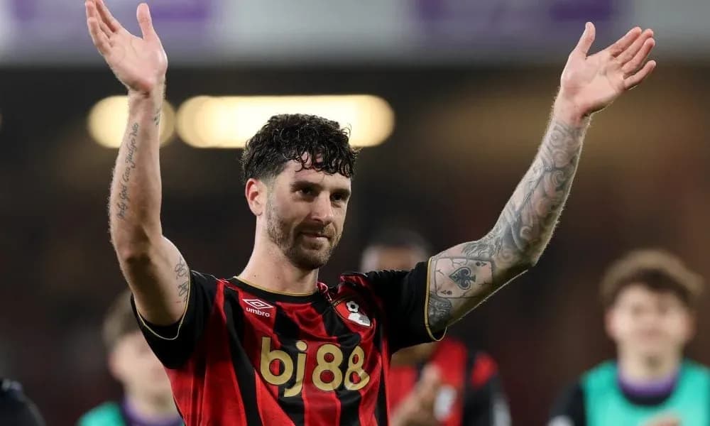 Player celebrating with fans after match victory Player celebrating with fans after match victory